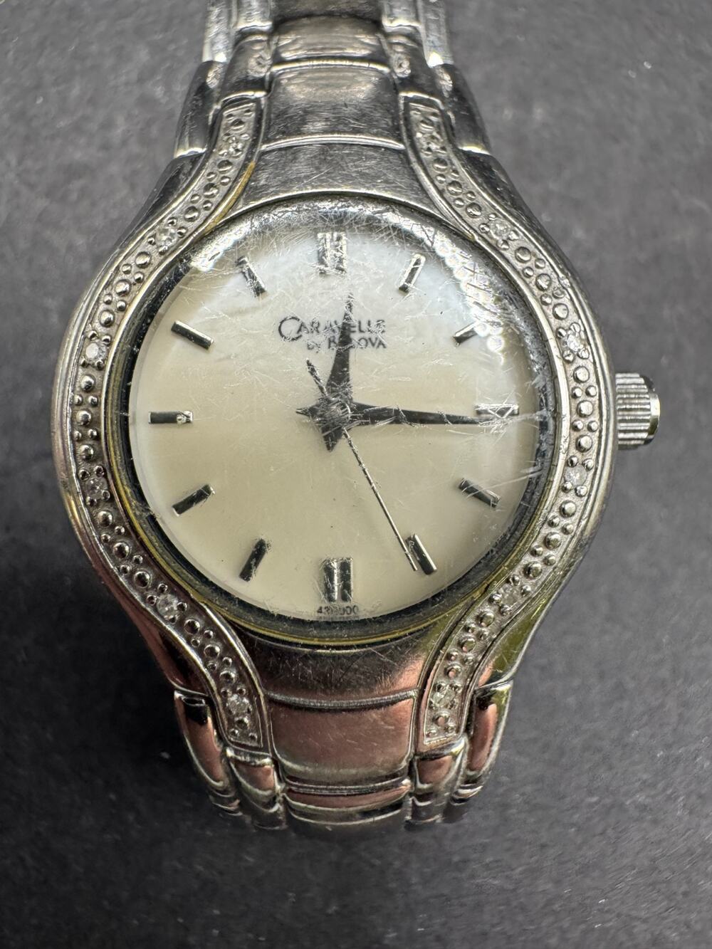 Vtg Caravelle by Bulova Silver Tone White Dial Diamond Accent Women’s Watch 24mm
